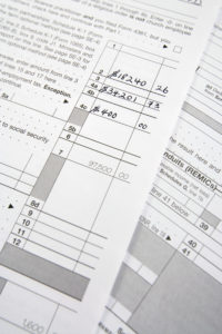 tax forms meant to demonstrate the complexity of how is alimony taxed in Massachusetts