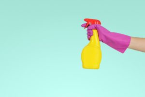 a squirt bottle of cleaning solution represents what a good spring cleaning after divorce can represent