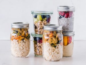 Delicious looking ingredients in glass jars, the results of meal prep for busy moms using our seven tips.