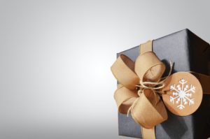A beautifully wrapped gift purchased with today's financial wellness tips for the new year in mind.
