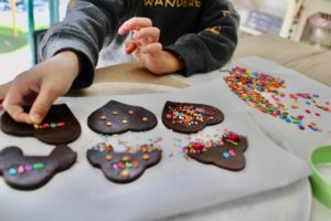 Get our tips for baking with little kids and make treats like these sprinkle decorated chocolate cookies.