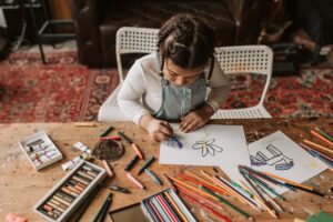 Coming up with ideas for DIY gifts for ex husband for Father's Day might be tough - we've got six ideas like the crafty one this little girl is working on ready for you!