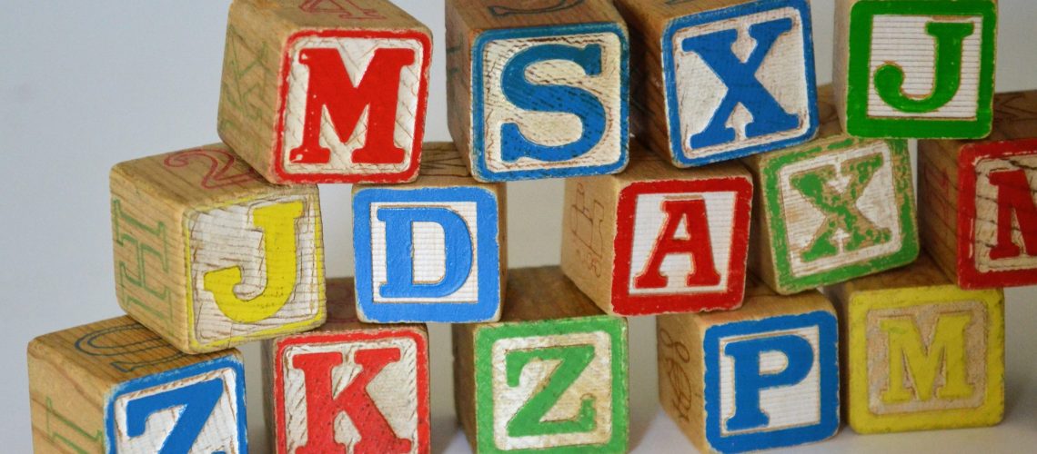 Wood blocks to teach the ABCs as a nod to today's list of divorce legal jargon terms you might need to know.