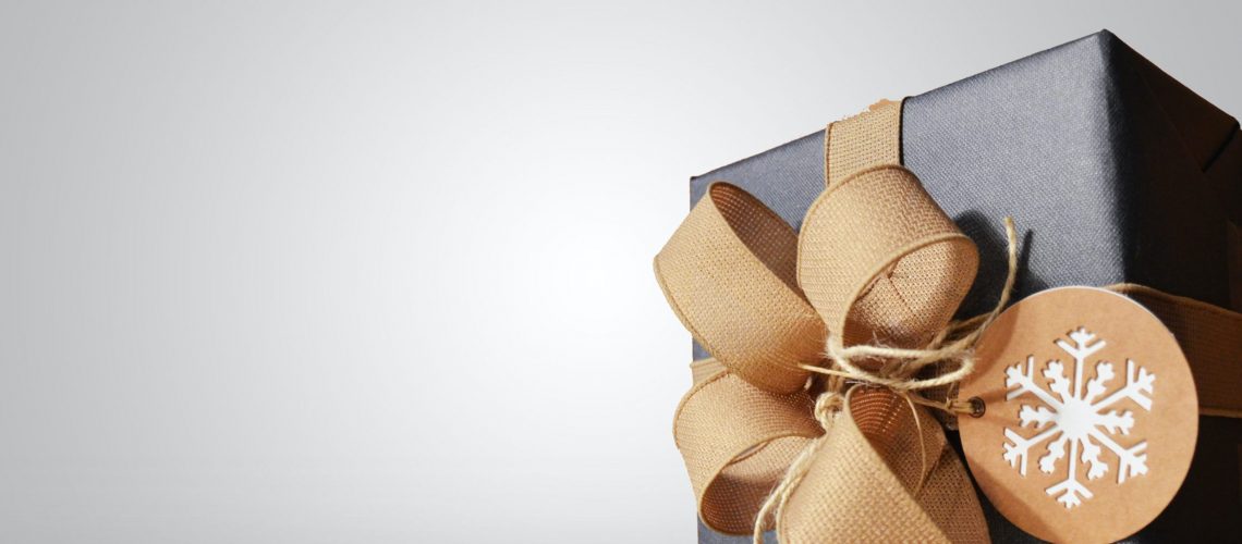 A beautifully wrapped gift purchased with today's financial wellness tips for the new year in mind.
