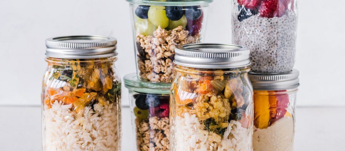 Delicious looking ingredients in glass jars, the results of meal prep for busy moms using our seven tips.